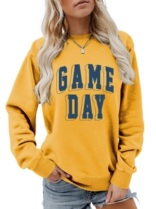 Detail of 3D Game Day letter print on mustard yellow crewneck sweatshirt fabric