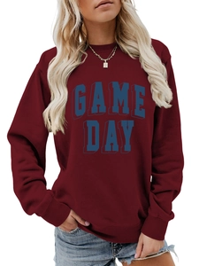 Detail of Game Day graphic on maroon crewneck sweatshirt with ribbed collar and cuffs