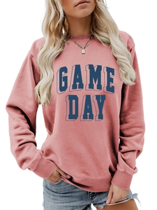 Detail of dusty pink sweatshirt with 3D blue Game Day puff print and ribbed cuffs