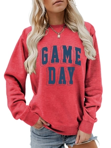 Detailed view of 3D Game Day lettering on a casual red crewneck sweatshirt with texture