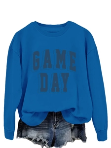Close-up of royal blue crewneck sweatshirt featuring a textured 3D GAME DAY puff print