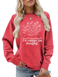Detail of red crewneck sweatshirt featuring floral book graphic and white typography