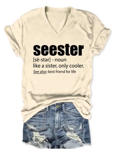Flat lay of cream V-neck T-shirt with black seester text print and denim shorts