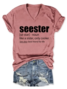 Flat lay of V-neck seester T-shirt paired with distressed blue denim shorts