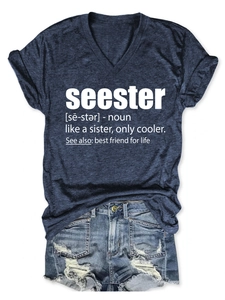 Flat lay of a V-neck seester slogan T-shirt paired with distressed denim shorts