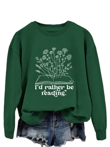 Detail of floral book illustration and I'd rather be reading text on dark green sweatshirt