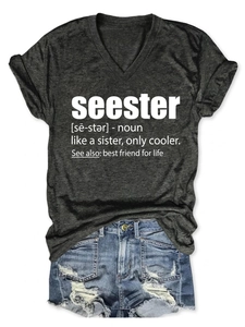 Detail of V-neck grey tee with seester print paired with distressed denim shorts