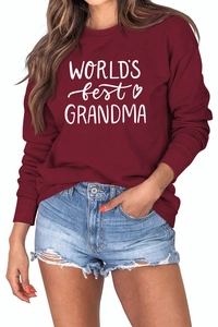 Close-up of World's Best Grandma print and soft fabric texture on burgundy sweatshirt