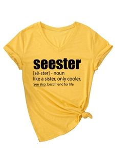 Detail of yellow V-neck T-shirt with black seester definition print and knotted hem