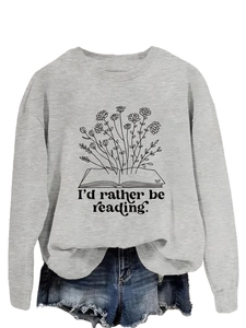 Close-up of I'd rather be reading print on grey sweatshirt tucked into denim shorts