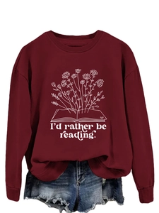 Detail of burgundy sweatshirt featuring floral book print and I'd rather be reading text