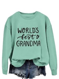 Close-up of mint green sweatshirt with rib-knit neckline and Grandma text print