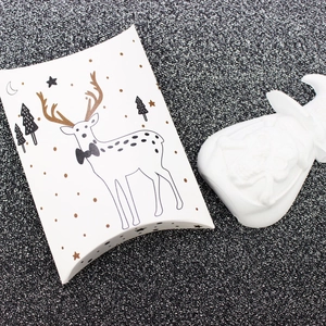 White Christmas reindeer pillow gift box with gold forest and star patterns