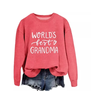 Relaxed round neck grandma sweatshirt in brick red paired with denim shorts