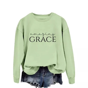 Mint green amazing grace graphic sweatshirt paired with distressed blue denim shorts
