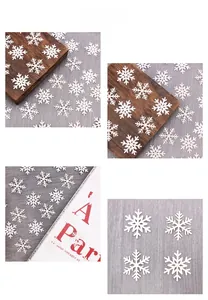 Macro shot of 100pcs white snowflake confetti ornaments for Christmas table decoration