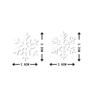 Set of two white 3D Christmas snowflake table decorations measuring 2.8cm by 3.2cm