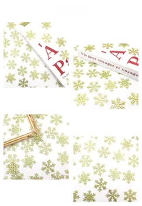 Close-up of golden glitter snowflake confetti for Christmas and winter holiday decorations