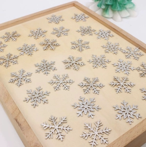 Close-up of sparkling silver glitter snowflake decorations for Christmas DIY projects