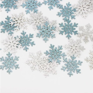 Blue and silver sparkling Christmas snowflake confetti for holiday party table decoration
