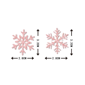 Pink glitter snowflake confetti for Christmas decor measuring 3.2cm in height and 2.8cm wide