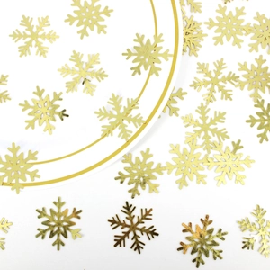 Golden snowflake sequins and glitter confetti for Christmas party table decorations