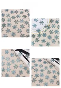 Close-up of light blue glitter snowflake decorations for Christmas party table settings