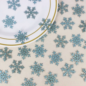 Sparkly ice blue snowflake confetti decorations for Christmas party and table decor