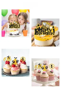 Detail showing bee themed glitter cake toppers with Happy Birthday and One text for party