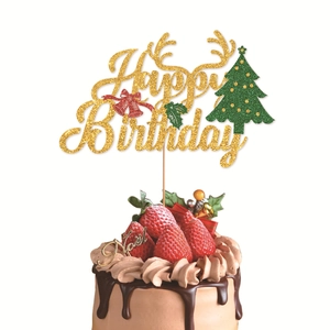 Glittery Happy Birthday cake topper with reindeer antlers and festive Christmas tree decor