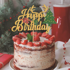 Glittery gold Happy Birthday cake topper with reindeer antlers and Christmas tree