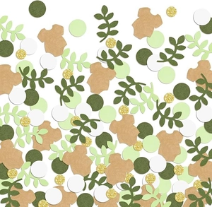 Detail of baby shower confetti featuring bodysuit and leaf shapes in forest theme colors