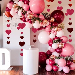 Romantic pink heart garlands and multihued balloon arch set for wedding or birthday decor