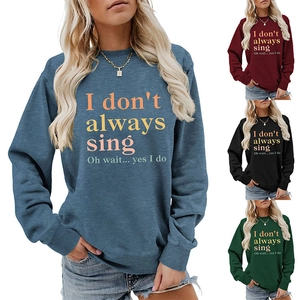 Detail of multi-color crewneck sweatshirts featuring slogan print and ribbed cuffs