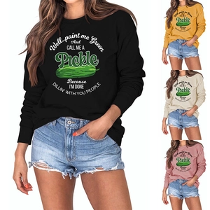 Detail of colorful sweatshirt fabric and pickle print in black, yellow, off-white and pink