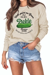 Detail of cream long sleeve sweatshirt featuring green pickle graphic and text print