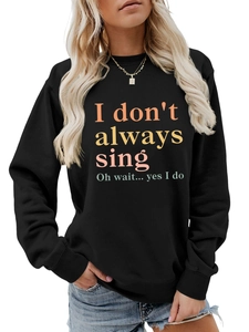 Detail of ribbed cuffs and vibrant gradient text on a black long-sleeve sweatshirt