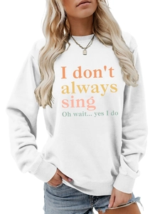 White crewneck sweatshirt detail with 'I don't always sing' text and ribbed cuffs