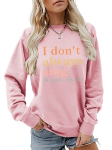 Detailed texture of pink crewneck sweatshirt with 'I don't always sing' print design