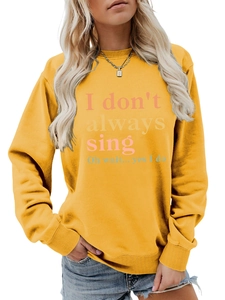 Close-up of humorous text print on comfortable yellow long sleeve crewneck sweatshirt
