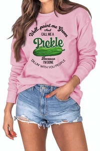 Detail of pink crewneck sweatshirt with humorous green pickle print and soft fabric texture