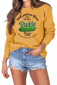 Detail of rib-knit cuffs and funny pickle print on yellow casual sweatshirt