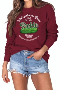 Detail of burgundy sweatshirt featuring rib-knit crewneck and pickles graphic print