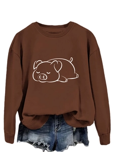 Detail of a brown crew neck sweatshirt featuring a cute white sleeping pig print motif