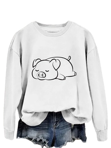 Close-up of white long-sleeve sweatshirt featuring a sleeping pig cartoon graphic
