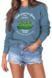 Detail of blue long sleeve sweatshirt featuring funny green pickle graphic and typography