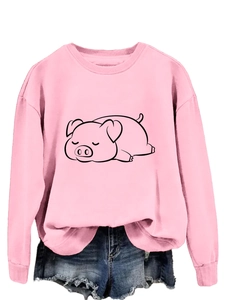 Close-up of pink crewneck sweatshirt with cute cartoon sleeping pig print details
