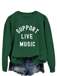 Close-up of Support Live Music text print on dark green crewneck sweatshirt top