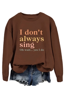 Brown sweatshirt with 'I don't always sing' print paired with frayed denim shorts