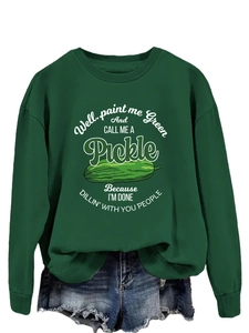 Detail of green crewneck sweatshirt with humorous pickle graphic and funny text